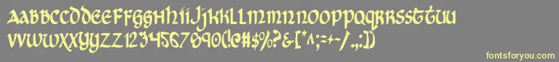 フォントCryUncialCondensed – 黄色のフォント、灰色の背景