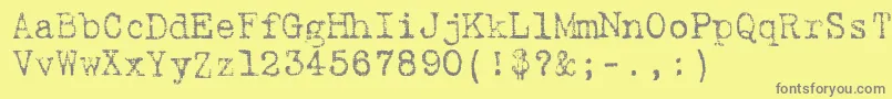 9fukolym-fontti – harmaat kirjasimet keltaisella taustalla