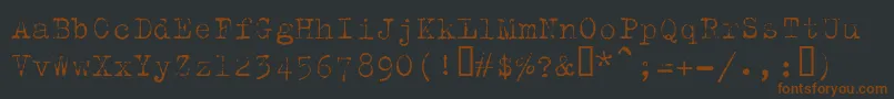 Шрифт Trixielight – коричневые шрифты на чёрном фоне