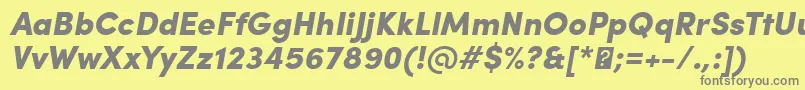 SofiaProBlackItalic-fontti – harmaat kirjasimet keltaisella taustalla