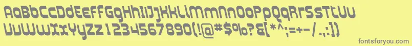 PlasmaticaRevBoldItalic-fontti – harmaat kirjasimet keltaisella taustalla