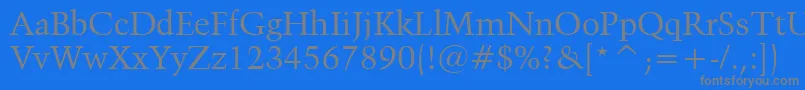 フォントKuenstler480Bt – 青い背景に灰色の文字