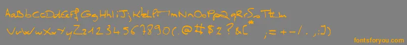 フォントMissClo – オレンジの文字は灰色の背景にあります。