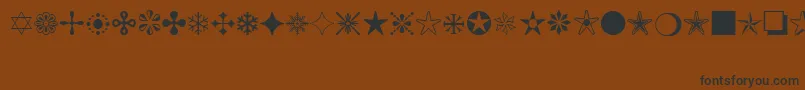 MonotypeSorts Font – Black Fonts on Brown Background