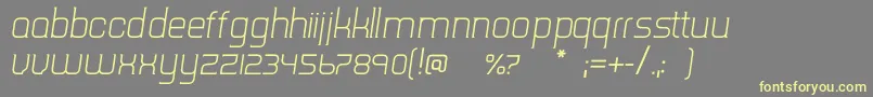 TripserifceLightitalic-Schriftart – Gelbe Schriften auf grauem Hintergrund