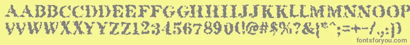 フォントQuakeroman – 黄色の背景に灰色の文字