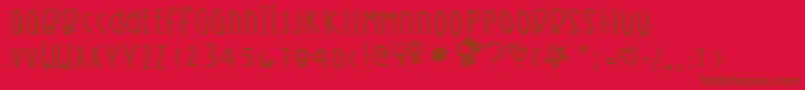Fonte Kirbysdreamland – fontes marrons em um fundo vermelho