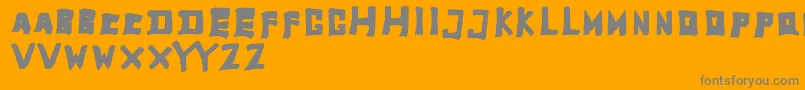 TobyfontFull-Schriftart – Graue Schriften auf orangefarbenem Hintergrund