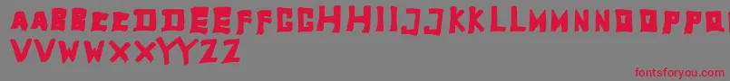 フォントTobyfontFull – 赤い文字の灰色の背景