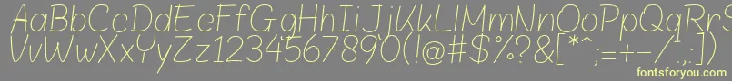 BloklettersPotlood Font – Yellow Fonts on Gray Background