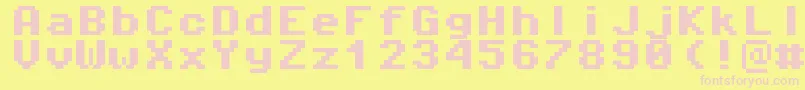 Czcionka Pixeloperatormono8Bold – różowe czcionki na żółtym tle