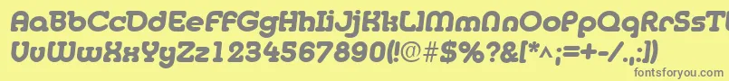 MedflyHeavy-fontti – harmaat kirjasimet keltaisella taustalla