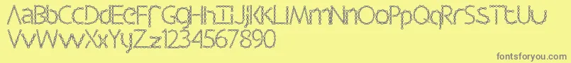 Czcionka Barbalicious – szare czcionki na żółtym tle