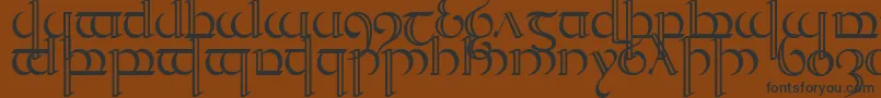 Quencap2-Schriftart – Schwarze Schriften auf braunem Hintergrund