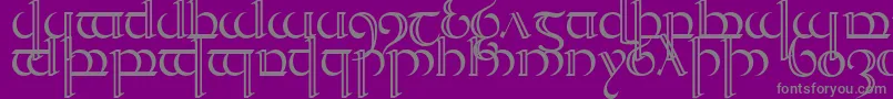 Quencap2-fontti – harmaat kirjasimet violetilla taustalla
