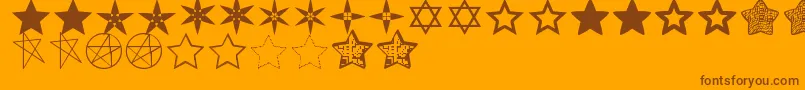 EstrellassTfb-fontti – ruskeat fontit oranssilla taustalla