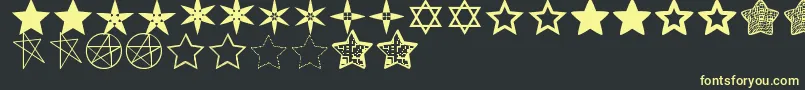 EstrellassTfb-fontti – keltaiset fontit mustalla taustalla