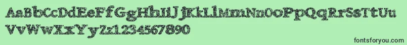 フォントDanishcrack – 緑の背景に黒い文字
