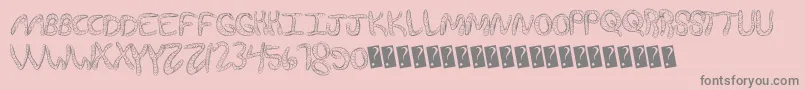Wurmfun-fontti – harmaat kirjasimet vaaleanpunaisella taustalla