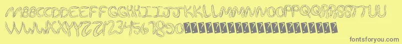 Wurmfun-fontti – harmaat kirjasimet keltaisella taustalla