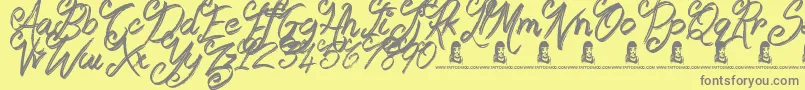 Fonte Booday – fontes cinzas em um fundo amarelo