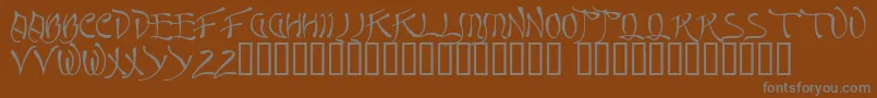 Quasi-fontti – harmaat kirjasimet ruskealla taustalla