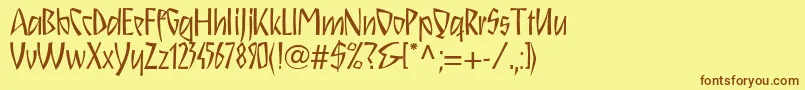 フォントSchnitzll – 茶色の文字が黄色の背景にあります。