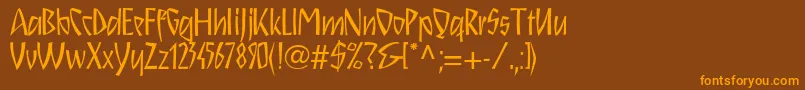 Schnitzll Font – Orange Fonts on Brown Background