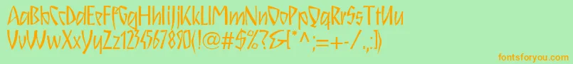 フォントSchnitzll – オレンジの文字が緑の背景にあります。