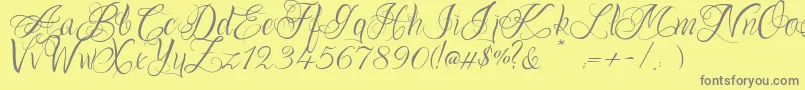 フォントOnechancescriptRegular – 黄色の背景に灰色の文字
