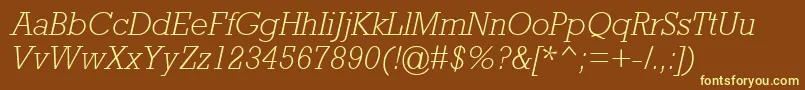 AstuteLightSsiLightItalic-fontti – keltaiset fontit ruskealla taustalla