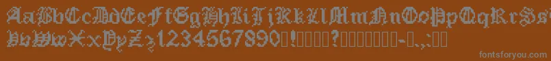 PixeledEnglishFont-fontti – harmaat kirjasimet ruskealla taustalla