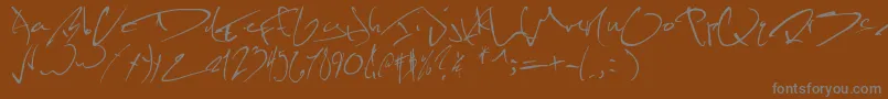 Kevinwildfont-Schriftart – Graue Schriften auf braunem Hintergrund