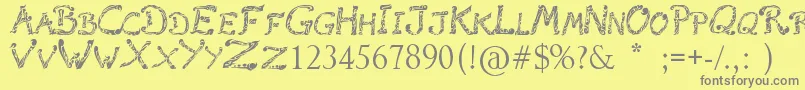 フォントRaslaniTribal – 黄色の背景に灰色の文字