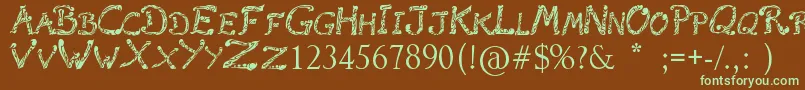 フォントRaslaniTribal – 緑色の文字が茶色の背景にあります。