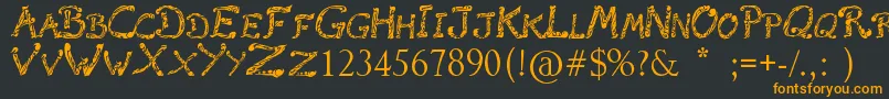 フォントRaslaniTribal – 黒い背景にオレンジの文字