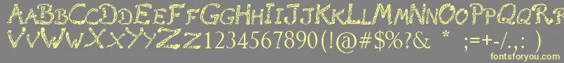 Подробнее о шрифте RaslaniTribal Шрифт RaslaniTribal – жёлтые шрифты на сером фоне