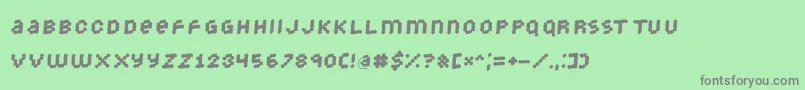 フォントStrongdots – 緑の背景に灰色の文字