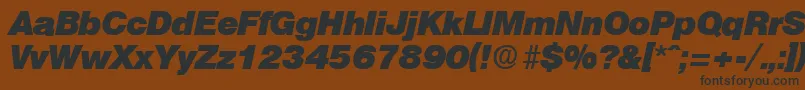 OlympiaHeavyita Font – Black Fonts on Brown Background