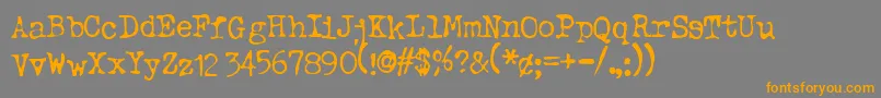 フォントTypeo ffy – オレンジの文字は灰色の背景にあります。
