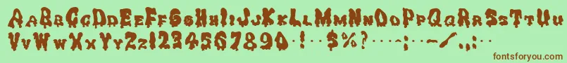 GhoulysolidRegular-Schriftart – Braune Schriften auf grünem Hintergrund