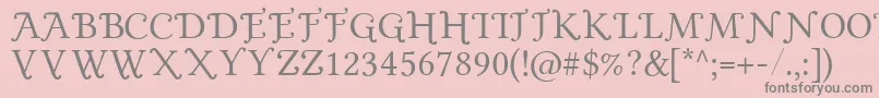 フォントGoldPlated – ピンクの背景に灰色の文字