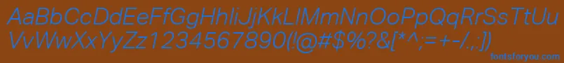 AktivgroteskcorpLightitalic-fontti – siniset fontit ruskealla taustalla