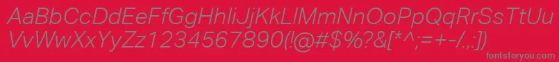 AktivgroteskcorpLightitalic-fontti – harmaat kirjasimet punaisella taustalla