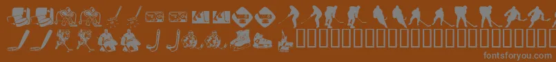 フォントKrHockeyDings – 茶色の背景に灰色の文字