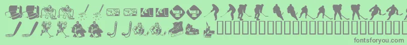 Fonte KrHockeyDings – fontes cinzas em um fundo verde