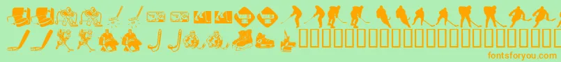 フォントKrHockeyDings – オレンジの文字が緑の背景にあります。
