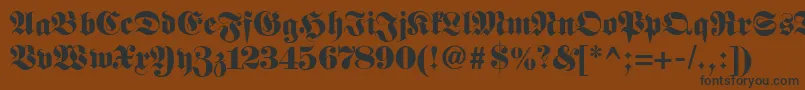 Fetteclassicunzfraktur-fontti – mustat fontit ruskealla taustalla