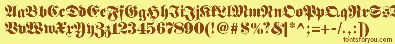 フォントFetteclassicunzfraktur – 茶色の文字が黄色の背景にあります。