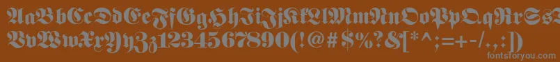 Fetteclassicunzfraktur-Schriftart – Graue Schriften auf braunem Hintergrund